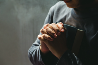 religious woman praying bible