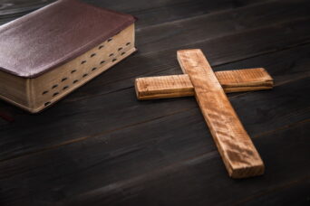 wooden cross with Holy Bible