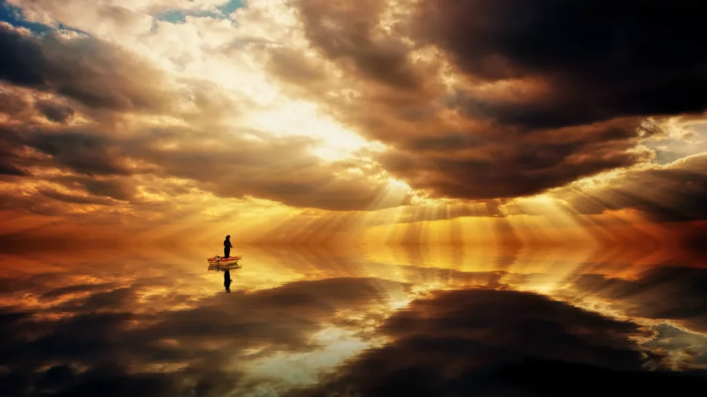 What Does Heaven Look Like According to the Bible: yellow sky with man on the boat 